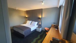 Letto o letti in una camera di HABAKUK Wellness & Event Hotel