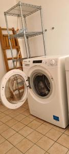 a washing machine in a room with at Adria Beach Apartment in Cavallino-Treporti