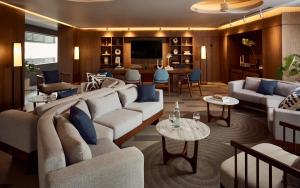 a living room with a couch and a table at Casa 17 Hotel Bangkok in Bangkok