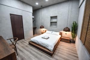 Postel nebo postele na pokoji v ubytování Eryang Homestay