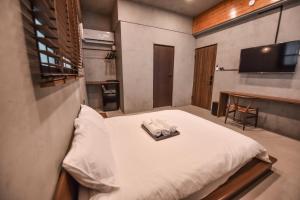 Postel nebo postele na pokoji v ubytování Eryang Homestay