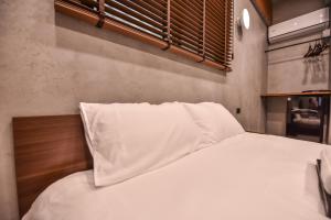 Postel nebo postele na pokoji v ubytování Eryang Homestay