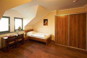 Postel nebo postele na pokoji v ubytování Hotel Horse Riding - Jezdecký Areál Tršice