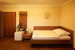 Postel nebo postele na pokoji v ubytování Hotel Horse Riding - Jezdecký Areál Tršice
