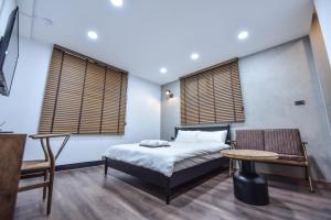 Postel nebo postele na pokoji v ubytování Eryang Homestay