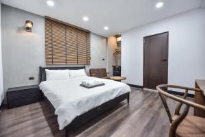 Postel nebo postele na pokoji v ubytování Eryang Homestay