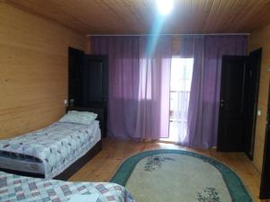 Postel nebo postele na pokoji v ubytování Guest house Ozernaya
