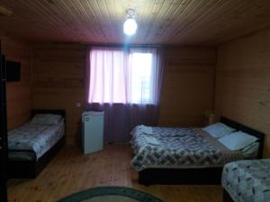 Postel nebo postele na pokoji v ubytování Guest house Ozernaya