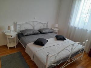 Łóżko lub łóżka w pokoju w obiekcie Apartments Palaziol