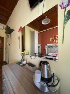 a tea kettle on a table in a room at La Bicicletta Rifiorita in Ferrara