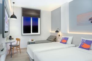 FOX Lite Hotel Samarinda客房内的一张或多张床位