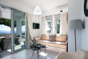 A television and/or entertainment centre at Evgoro Luxury Suites