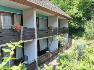 a building with potted plants on the balconies at Hotel Suggenbad in Waldkirch