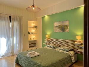 A bed or beds in a room at 1 BedRoom Apt - Live Like A Local In Kolonaki