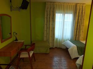 Łóżko lub łóżka w pokoju w obiekcie Hotel Rural Venta Del Alon