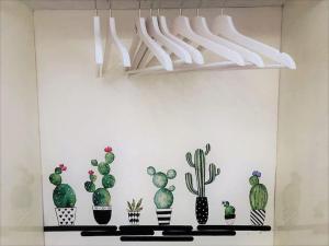 a group of cacti and succulents on a shelf at La Casa di Litz in Naples