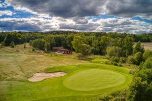 an aerial view of a golf course with a green field at Kiladalens Golf & Lodge in Nyköping