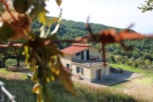 a small house in the middle of a field at Le Cascate Bed and Breakfast in San Fele