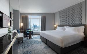 Ein Bett oder Betten in einem Zimmer der Unterkunft Centara Grand At CentralWorld