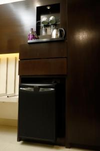 Kuchyň nebo kuchyňský kout v ubytování Udman Hotel Chhattarpur