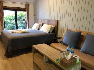Postel nebo postele na pokoji v ubytování Likita Resort
