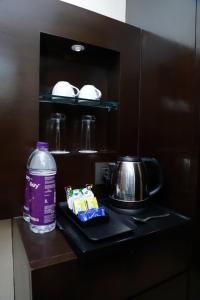 Kuchyň nebo kuchyňský kout v ubytování Udman Hotel Chhattarpur