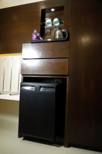 Kuchyň nebo kuchyňský kout v ubytování Udman Hotel Chhattarpur