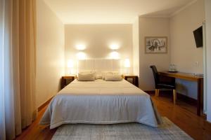 Cama ou camas em um quarto em Hotel Casa da Nora
