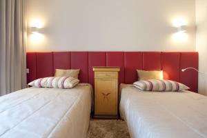 Cama ou camas em um quarto em Hotel Casa da Nora
