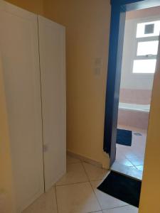 an empty room with a door and a window at DO ALL BY WALKING DISTANCE IN ALAIN in Al Ain