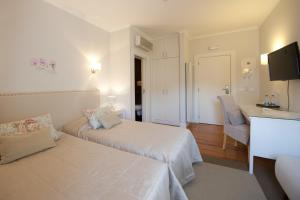 Cama ou camas em um quarto em Hotel Casa da Nora