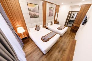 Postel nebo postele na pokoji v ubytování Wisteria Hotel + 14 fotografií