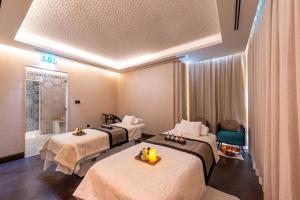 Кровать или кровати в номере Shaza Doha