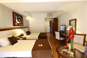 Postel nebo postele na pokoji v ubytování Starlet Hotel
