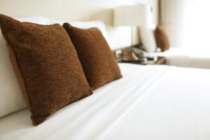 Postel nebo postele na pokoji v ubytování Starlet Hotel