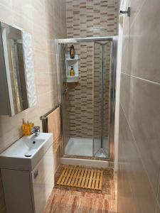 a bathroom with a shower and a sink at GOZO TA CENC RESIDENCE WITH COMMUNAL POOL in Sannat