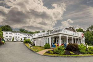 a large white house with a porch at Comfort Inn Halifax in Halifax