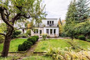 an image of a house with a yard at Beach House Escape in Gdynia