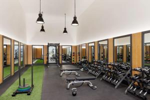 a gym with rows of treadmills and machines at Stunning Centrally Located Apartments at New River Cove in South Florida in Fort Lauderdale