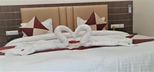Postel nebo postele na pokoji v ubytování Hotel MK Grand