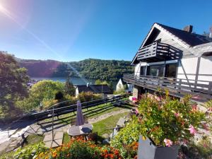a house with a view of a lake at Ferienhaus Sonnendeck in Simmerath