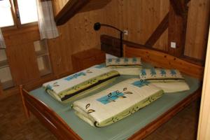 two beds sitting on a table in a room at Plazzetta 23 in Sent