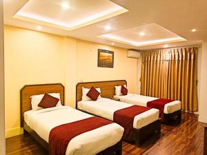 Krevet ili kreveti u jedinici u okviru objekta Thamel Grand Hotel