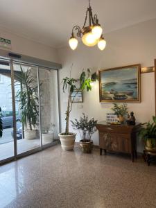 a room with potted plants on the walls at A Mariña in Cambados