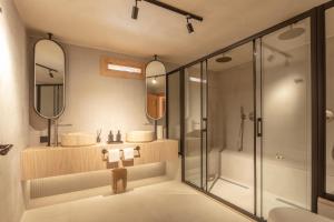 a bathroom with two sinks and a shower at Ultava Houses in Datca +49 photos