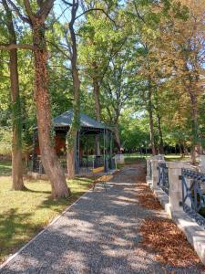 a park with benches and a gazebo in a park at Gartenhotel Altmannsdorf in Vienna