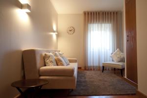 Uma área de estar em Hotel Casa da Nora