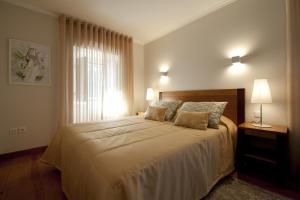 Cama ou camas em um quarto em Hotel Casa da Nora