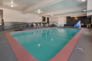a large swimming pool in a hotel room at Red Lion Inn & Suites Ontario in Ontario