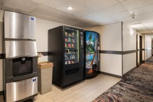 a vending machine in a room with a refrigerator at Red Lion Inn & Suites Ontario in Ontario
